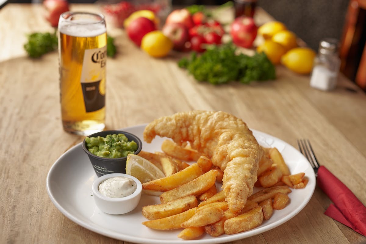 Classic Cornish fish and chips — battered fish with chunky chips, mushy peas and tartar sauce